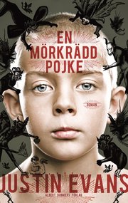En m�rkr�dd pojke (inbunden)