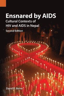 David K Beine - Ensnared by AIDS, Häftad
