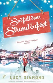 Snöfall över strandcaféet